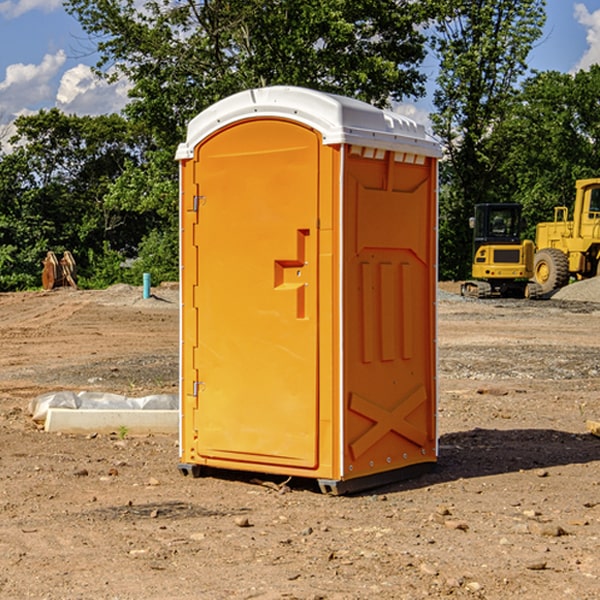 what is the cost difference between standard and deluxe portable restroom rentals in Tipton